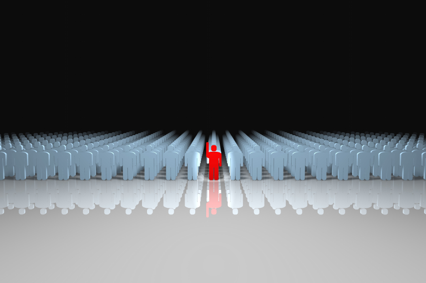 A red figure stands out among a large crowd of white figures under a gradient black-to-white background. The red figure, like executive recruiters, is lifting one arm while the rest remain motionless, creating a striking contrast. The ground reflects all the figures.