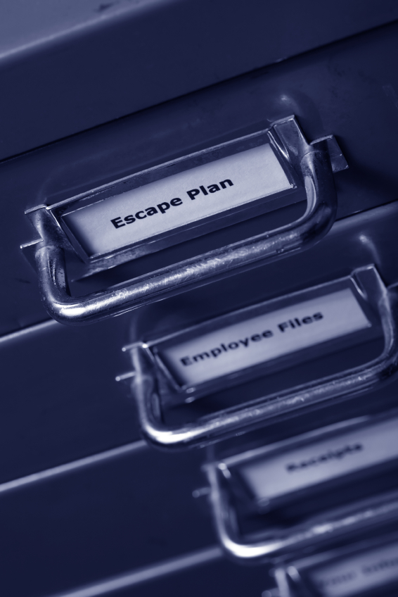 A close-up of a filing cabinet drawer handle with a label reading "Escape Plan." Below, partially visible, are drawers labeled "Employee Files" and "Receipts." The image has a blue tint and focuses on the handles and labels, suggesting an organized system for managing important documents.
