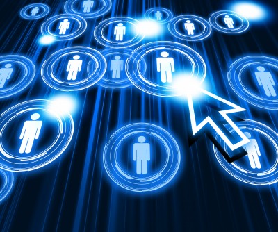 A digital illustration with interconnected glowing icons of people and a large, white arrow cursor pointing at one icon. The background is dark with blue light effects, suggesting a network or technology concept related to a government career.