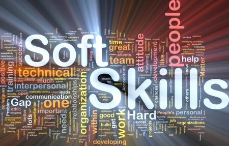 A vibrant word cloud features "Soft Skills" in bold white, with notable words like "people," "organization," "work," "job skills," and "communication." A radiant gradient background, with beams of light emanating from the center, adds a dynamic touch.