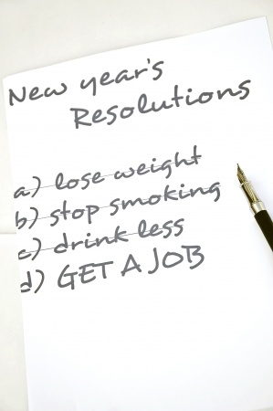 A piece of paper titled "New Year's Resolutions" lists four goals: a) lose weight, b) stop smoking, c) drink less, and d) GET A JOB. A pen is placed on the right side of the paper, ready for checking off accomplishments and interviewing notes.