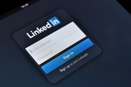 A screen displaying the LinkedIn sign-in page with fields for email address and password. Below the fields, there's a blue "Sign In" button and a clickable link that reads "Sign up to join LinkedIn" to create an account.