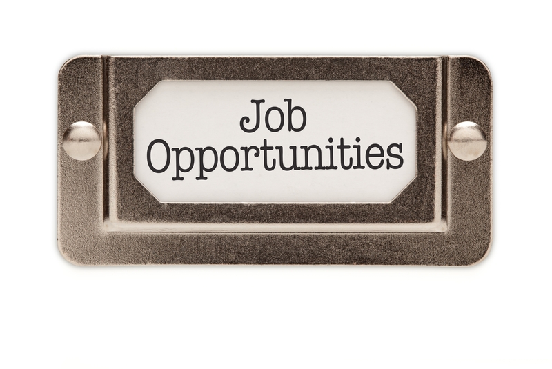A metallic label holder with a white insert displaying the text "Job Opportunities" in black letters, providing a clear and professional presentation for potential candidates.