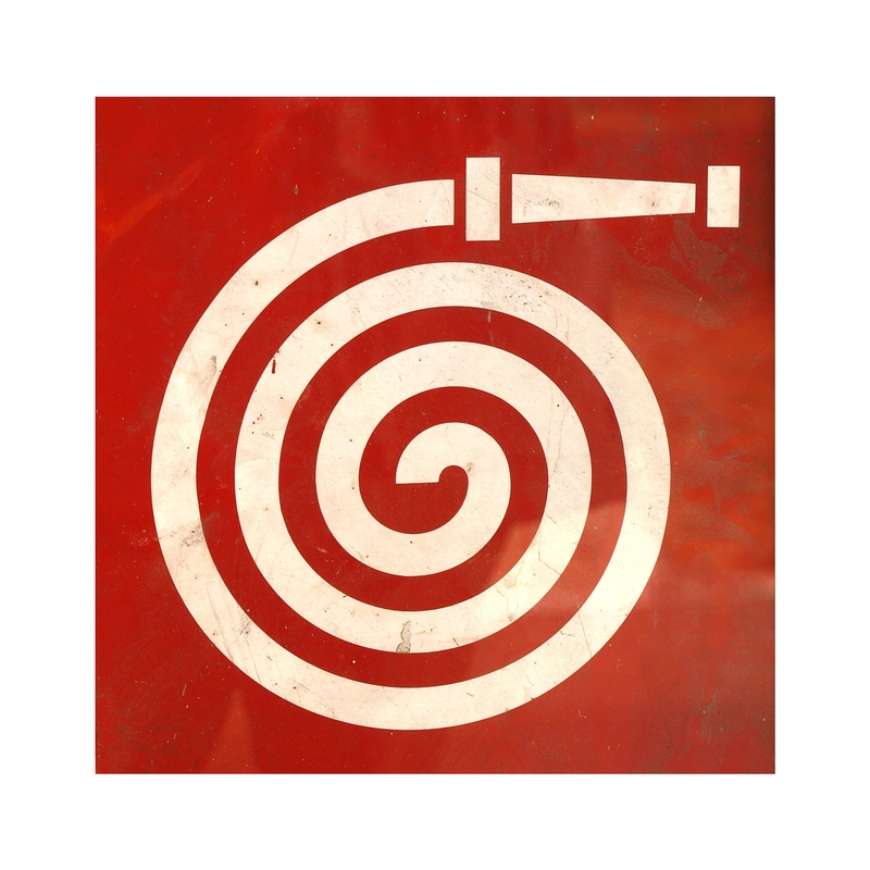 A red square sign featuring a white fire hose symbol with a rolled-up hose and nozzle. The design is simple and modern, indicating the availability of fire-fighting equipment in case of emergency, just as a detailed fire service resume showcases one's readiness and preparedness.