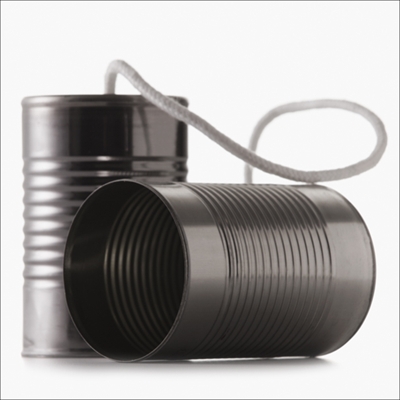 Two tin cans connected by a string, resembling a homemade telephone. One can is standing upright, while the other is lying on its side, facing the viewer. The string forms a loop between the two cans, hinting at the simplicity and creativity often needed in a job search.