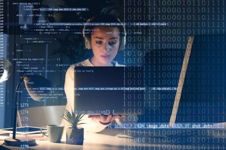 A developer wearing headphones sits at a desk, focused on her laptop screen. The image is overlaid with lines of code and binary numbers. A small plant and notepad are placed on the desk beside her.