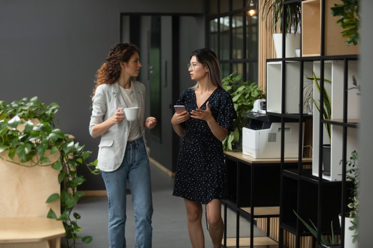 Two woman while office break engaged in a conversation